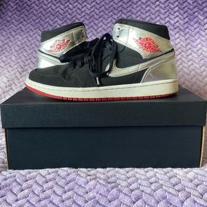 silver and black jordan’s